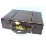 A vintage crocodile jewellery box