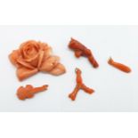 Five pieces of carved coral including a rose plaque, two a/f