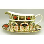 A Royal Crown Derby 1128 pattern gravy boat with stand
