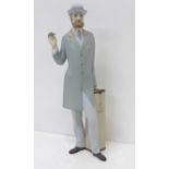 A Royal Dux figure of a gentleman, 25cm