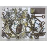 A collection of eleven early door/cabinet keys, and assorted other keys including watch keys and a