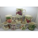 Eight Moorcroft mugs, one with chip to base