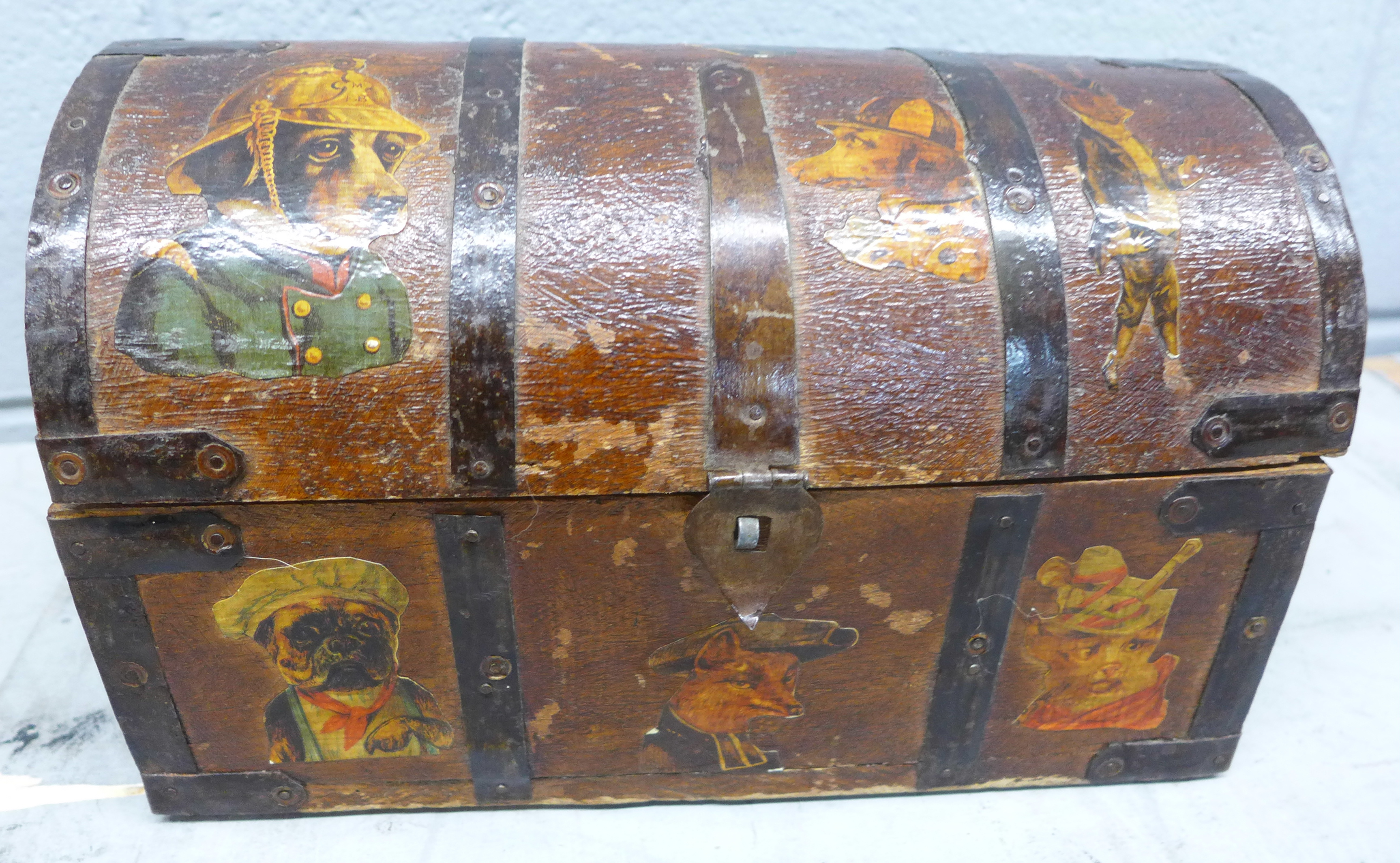 A wooden domed top box with decoupage scraps