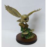 A Border Fine Arts figure of an owl in flight (wing restored)