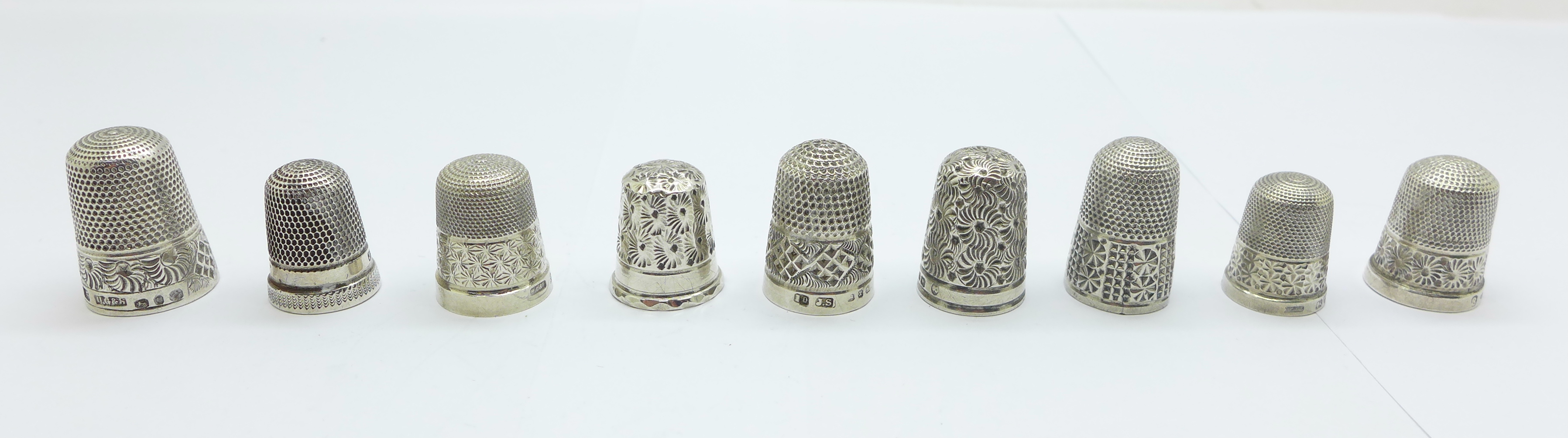 Nine silver thimbles including six late Victorian