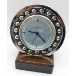 A novelty SKF of Sweden ball bearing clock on stand, 75th anniversary 1982, (battery movement)