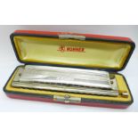 A Hohner The 64 Chromonica Professional model harmonica, cased