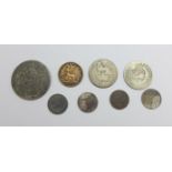 Eight coins including a Victorian 1885 One Third Farthing, a Victorian shilling, etc.