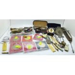 Three pairs of spectacles, penknives, commemorative crowns, souvenir spoons, etc.
