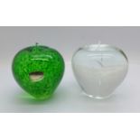 Two glass apple paperweights including one in green by Wedgwood