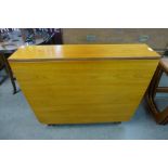 A McIntosh teak drop leaf table