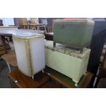 Two painted wicker linen boxes and a bedside table