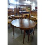 A Danish Frem Rojle teak roundette table and four chairs, designed by Hans Olsen