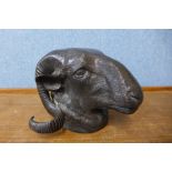 A bronze ram's head, 14cms h