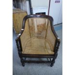 An oak barleytwist bergere armchair