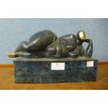 An bronze figure, a reclining female nude, 25cms w x 17 cms h