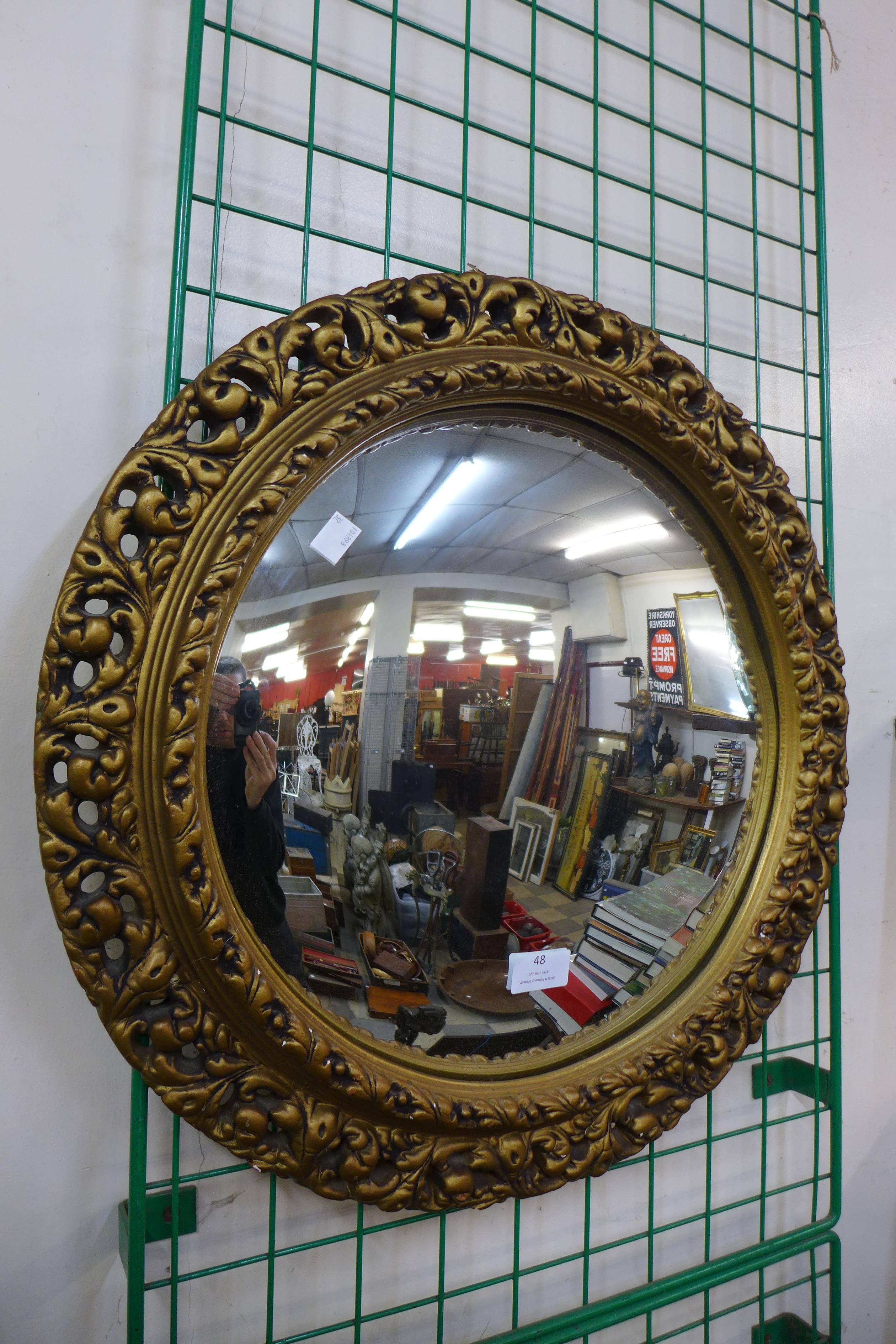 A gilt framed convex mirror