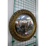 A gilt framed convex mirror