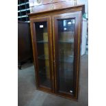 An inlaid mahogany wall mounted display cabinet