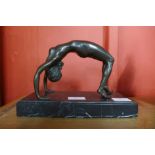 An erotic female bronze sculpture on marble base, 17cms h.