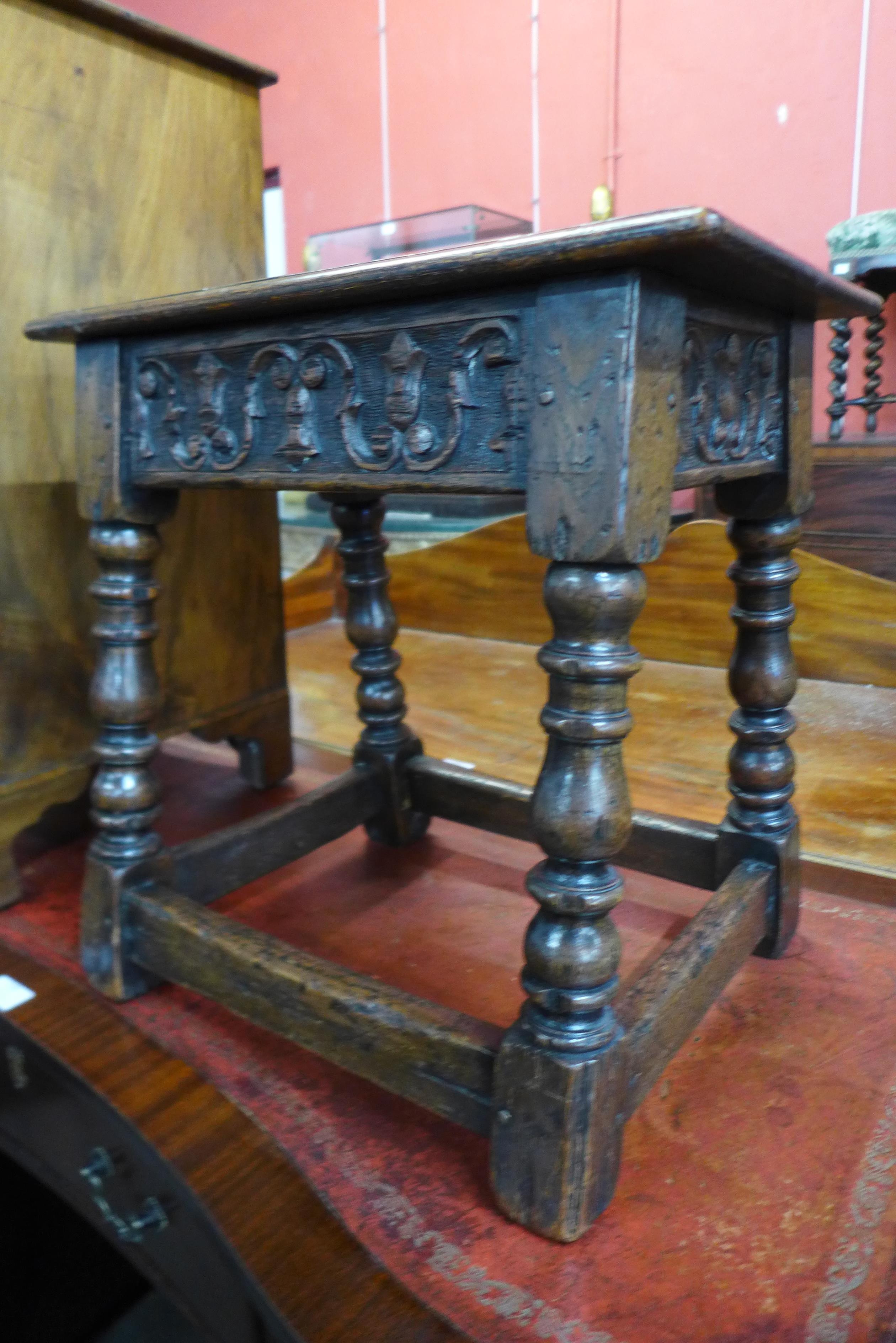 A 17th Century style carved oak stool - Image 2 of 2