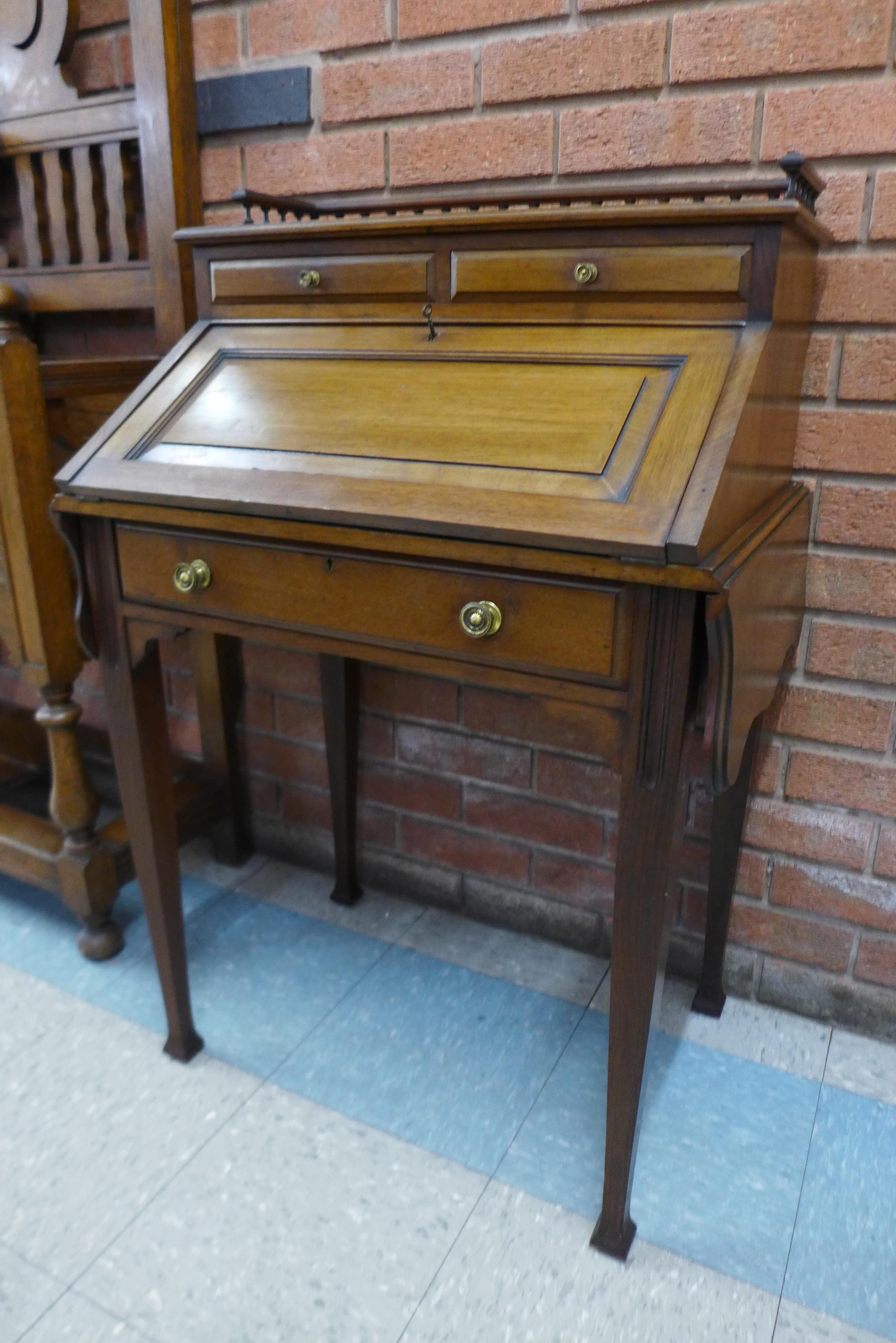 An Edward VII mahogany bureau de dame, 100cms h, 97cms w, 47cms d.