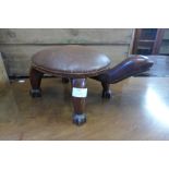 A small hardwood turtle shaped stool