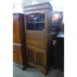 An early 20th Century oak secretaire bookcase