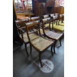 A set of four Regency mahogany and bergere seated dining chairs