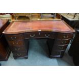 A mahogany kneehole desk, 76cms h, 120cms w, 56cms d.