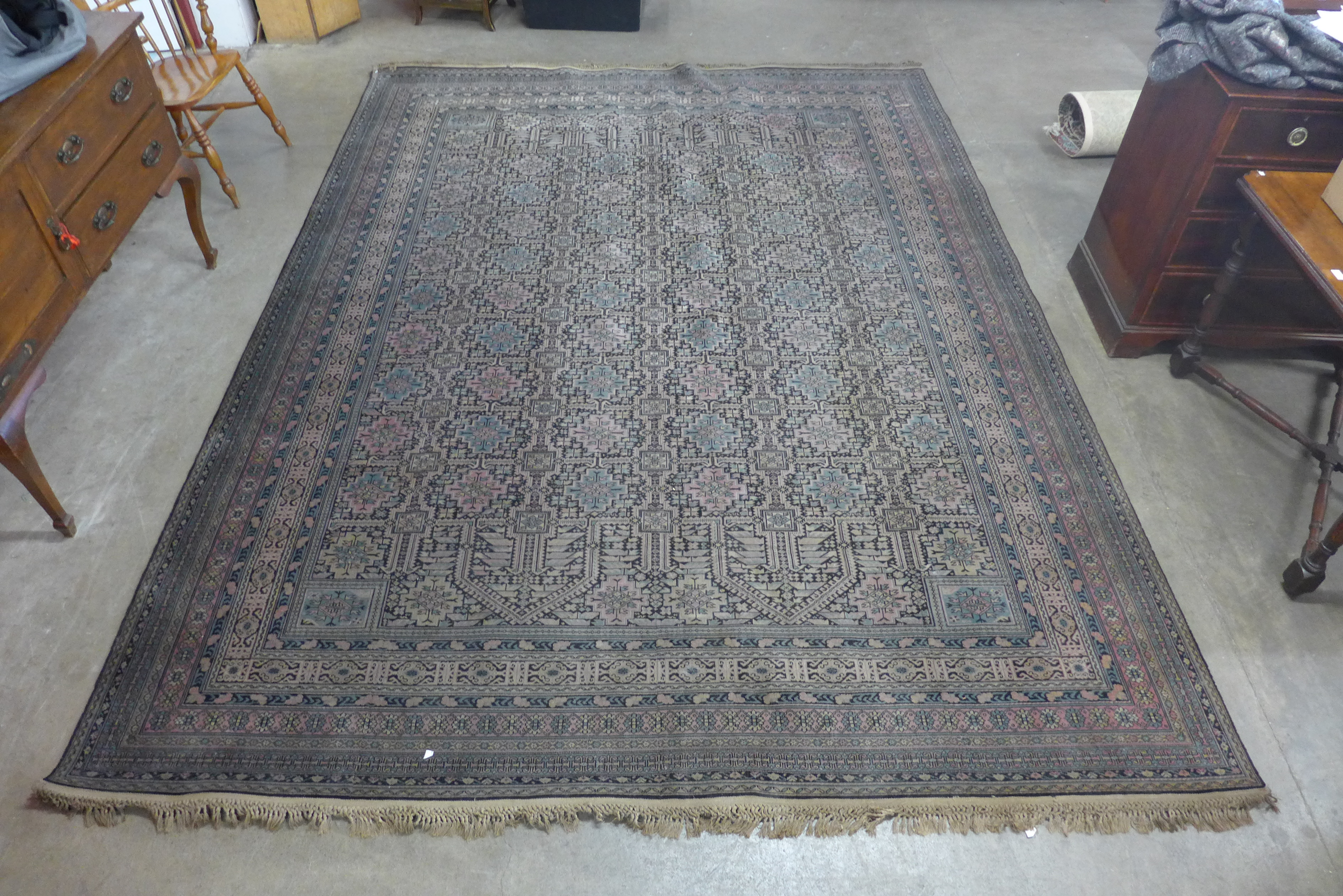 A large blue, red and black ground rug