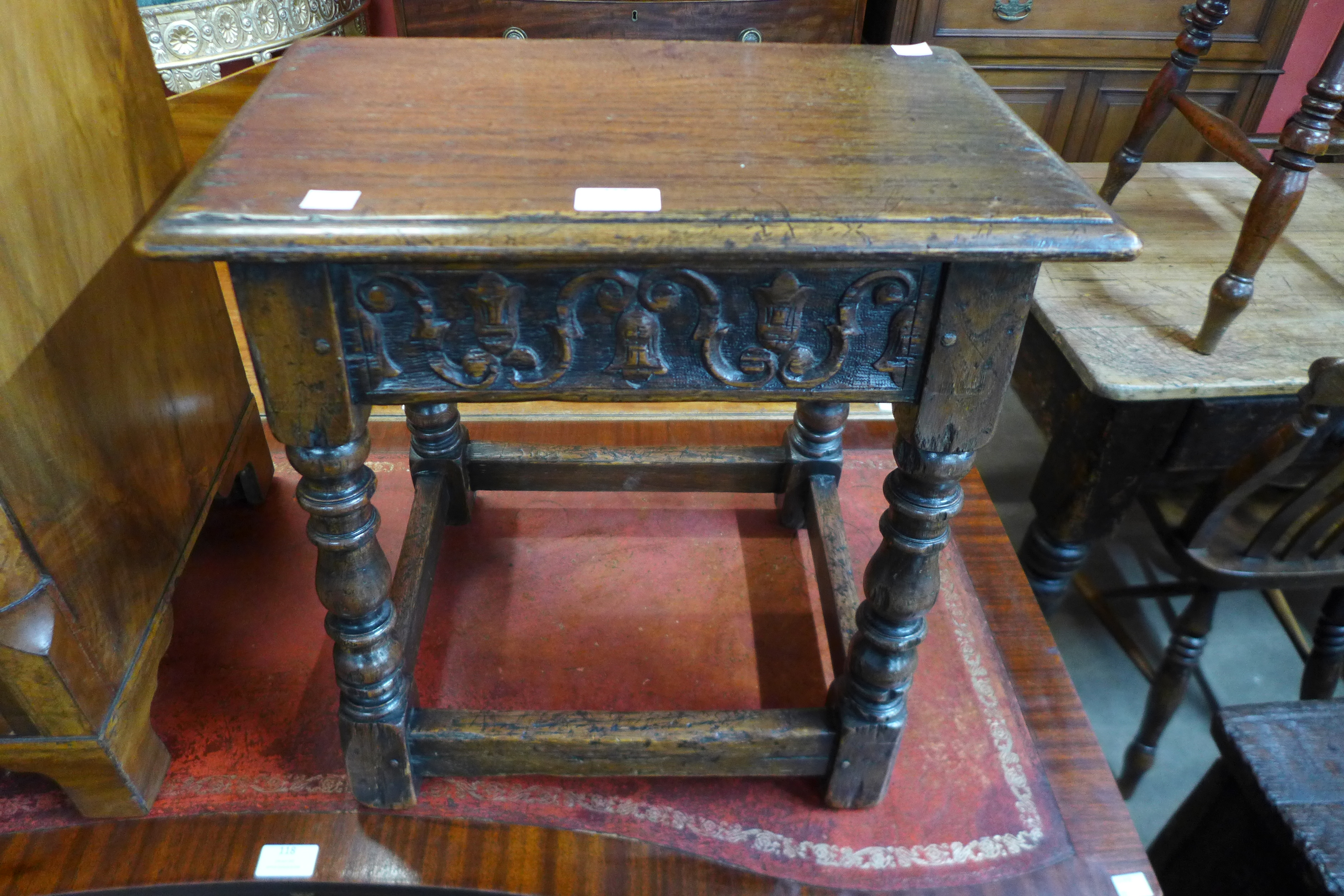 A 17th Century style carved oak stool