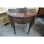 An Edward VII Adams Revival carved mahogany demi lune side cabinet, 102cms h, 120cms w, 61cms d.