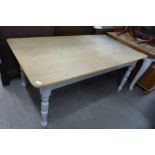 A painted pine two drawer dining table