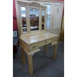 A French carved pine dressing table, 158cms h, 90cms w, 49cms d.