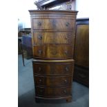 A mahogany bow front chest on chest