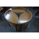 A Nathan teak and glass topped circular nest of tables