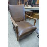 An oak and upholstered armchair