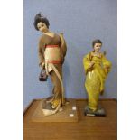 Two Japanese dolls and a carved wood lamp