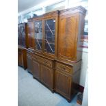 A mahogany breakfront bookcase ( with associated top )