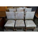 A set of eight carved oak dining chairs