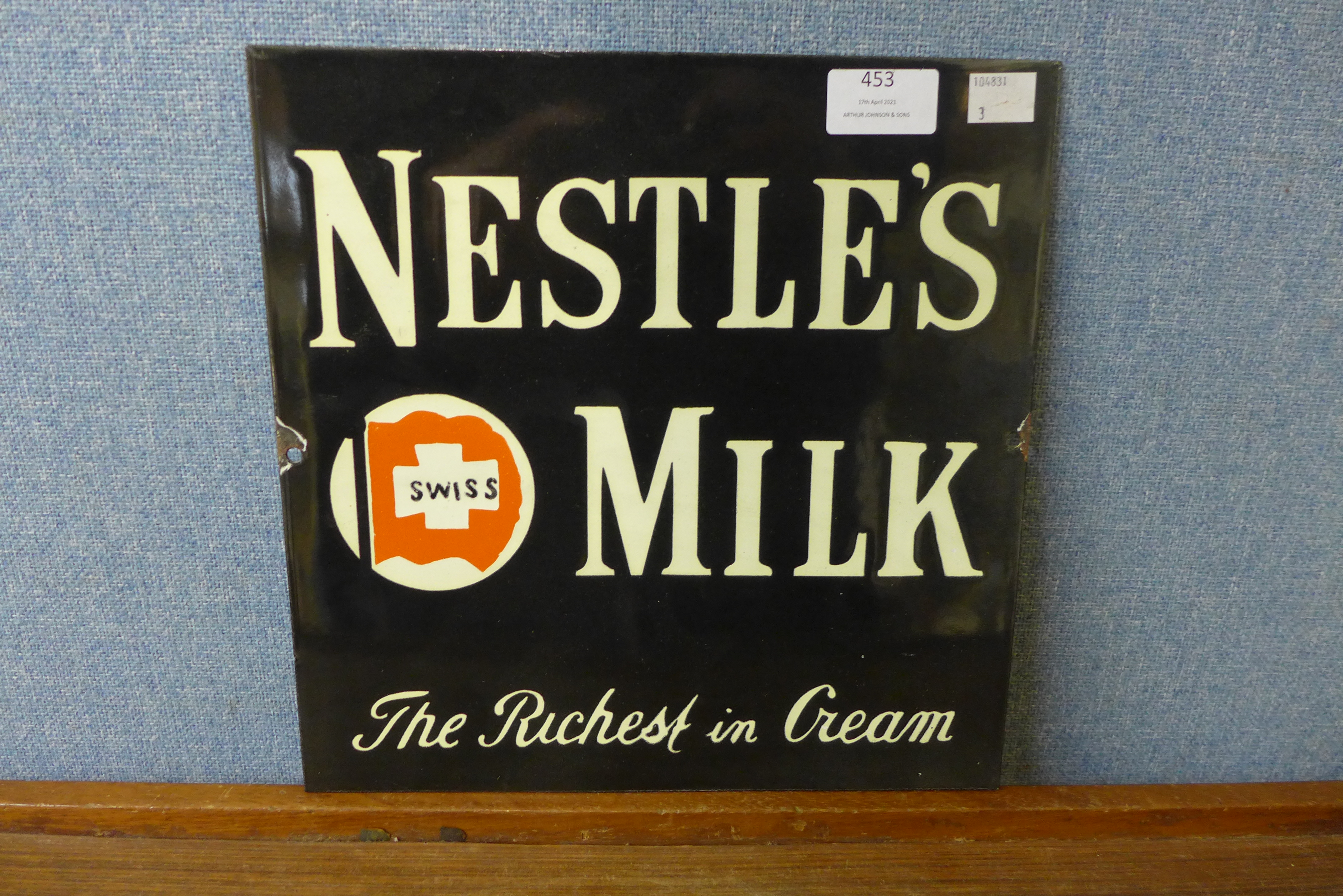 A Nestle's Milk enamelled sign