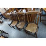 A set of four Victorian elm and beech kitchen chairs