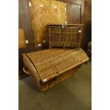 A wicker picnic basket and fishing basket