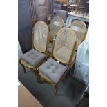 A set of four beech bentwood and bergere chairs