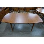 A teak extending dining table