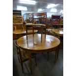 A Nathan teak extending dining table and four chairs