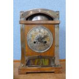 An early 20th Century Jugendstil oak and metal mounted mantel clock, 36cms h