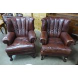 A pair of Tetrad Blake mahogany and chestnut brown leather armchairs