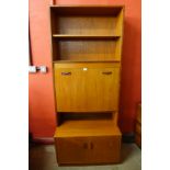 A G-Plan Sierra teak bookcase and a teak drop leaf table